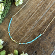 Matte turquoise and brass beaded stream necklace, 16-18" adjustable matte gold chain